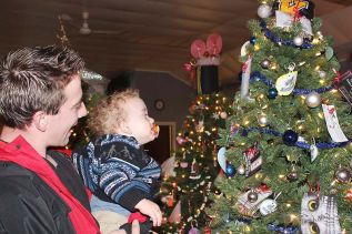 Porter Badour seems to have found his favourite tree with a helping hand from dad Zach Badour.